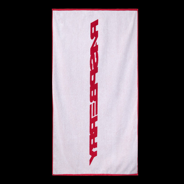 GV Gallery Red Beach Towel, reverse side in white terry with a red Raspberry wordmark and red border