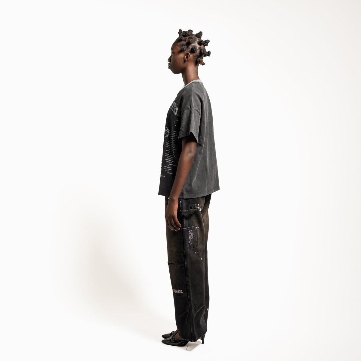 Model wearing the Stile De Amor 1950 Splatter denim pants, side view of the wide leg