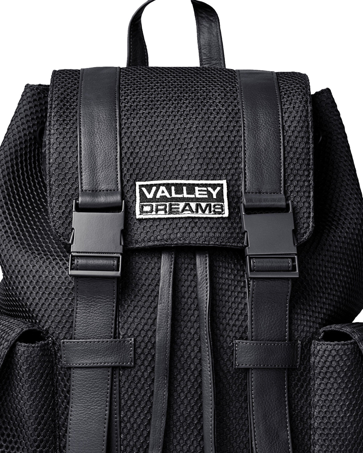 Vale Black Ops Backpack, close-up of the Valley Dreams patch and black buckles on textured mesh