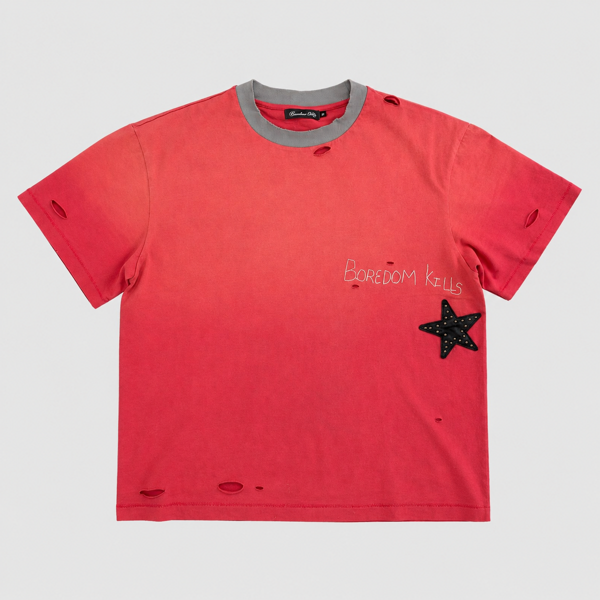 Boredom Kills Stardom T-Shirt front — faded red distressed tee with a grey collar, script logo and a studded black star