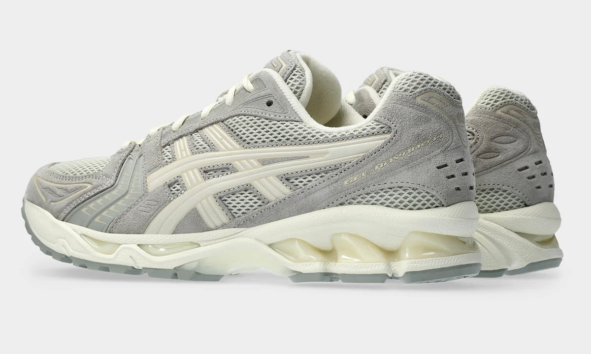 Asics Gel-Kayano 14 White Sage Smoke Grey, angled side view showing grey mesh panels and off-white side stripe