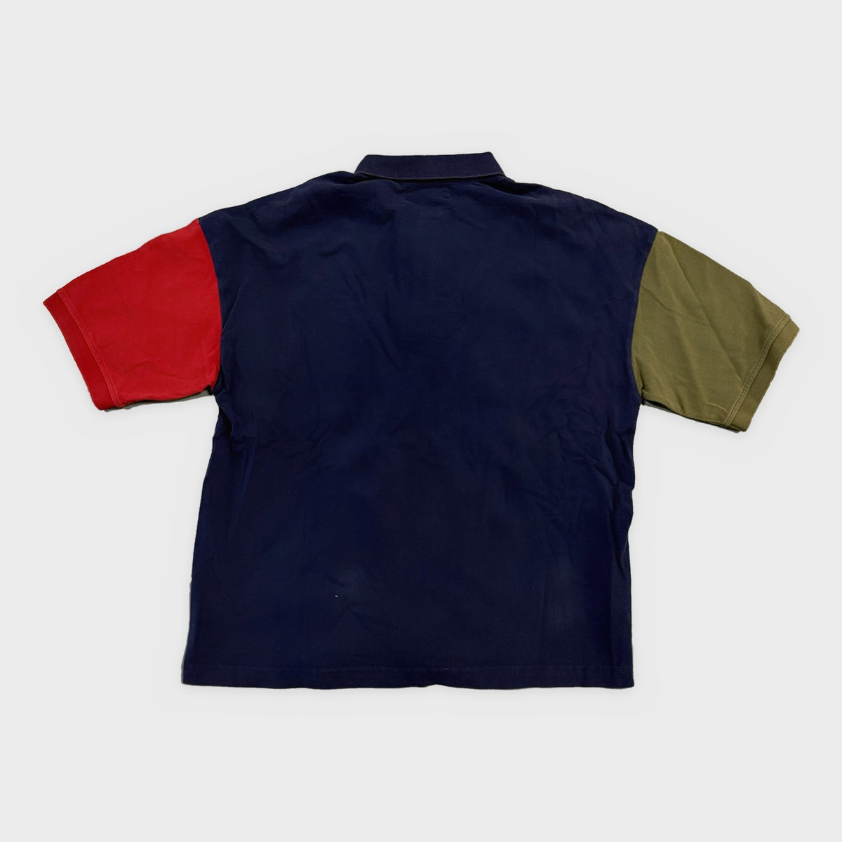 HMDD Colorblock Polo, back of the navy polo with red and olive colorblock sleeves