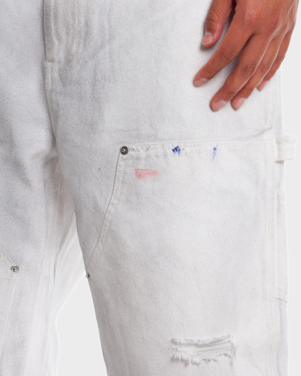 HMDD Big Ed Work Pants, close-up of the carpenter pocket, paint flecks and knee rip
