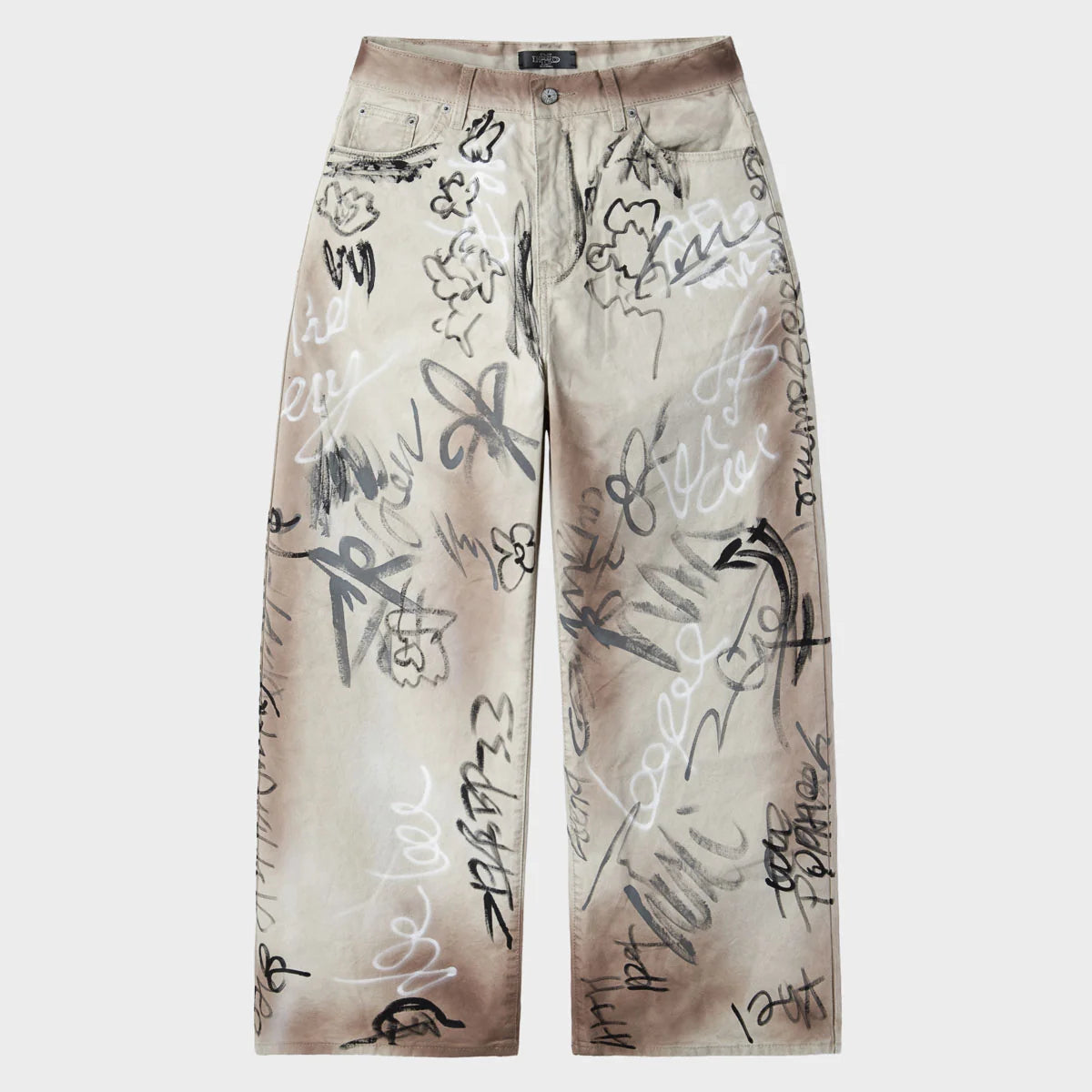 Baggy ecru canvas trousers covered in black and white graffiti scribbles, front view