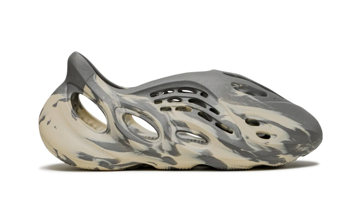 Adidas Yeezy Foam Runner MXT Moon Gray, angled side view of the foam upper and open vents