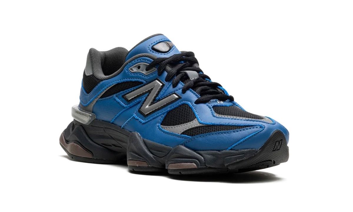New Balance 9060 Dark Royal Brown, medial three-quarter view of the blue upper and grey N
