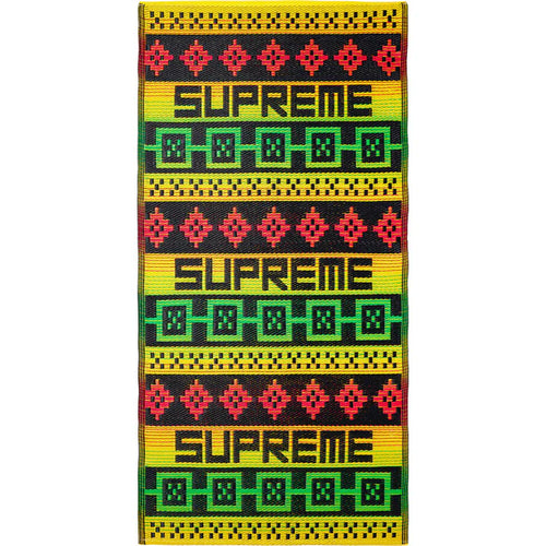 Supreme Yellow Sosenap Plastic Mat, woven yellow plastic mat with red and green geometric bands and repeated block lettering
