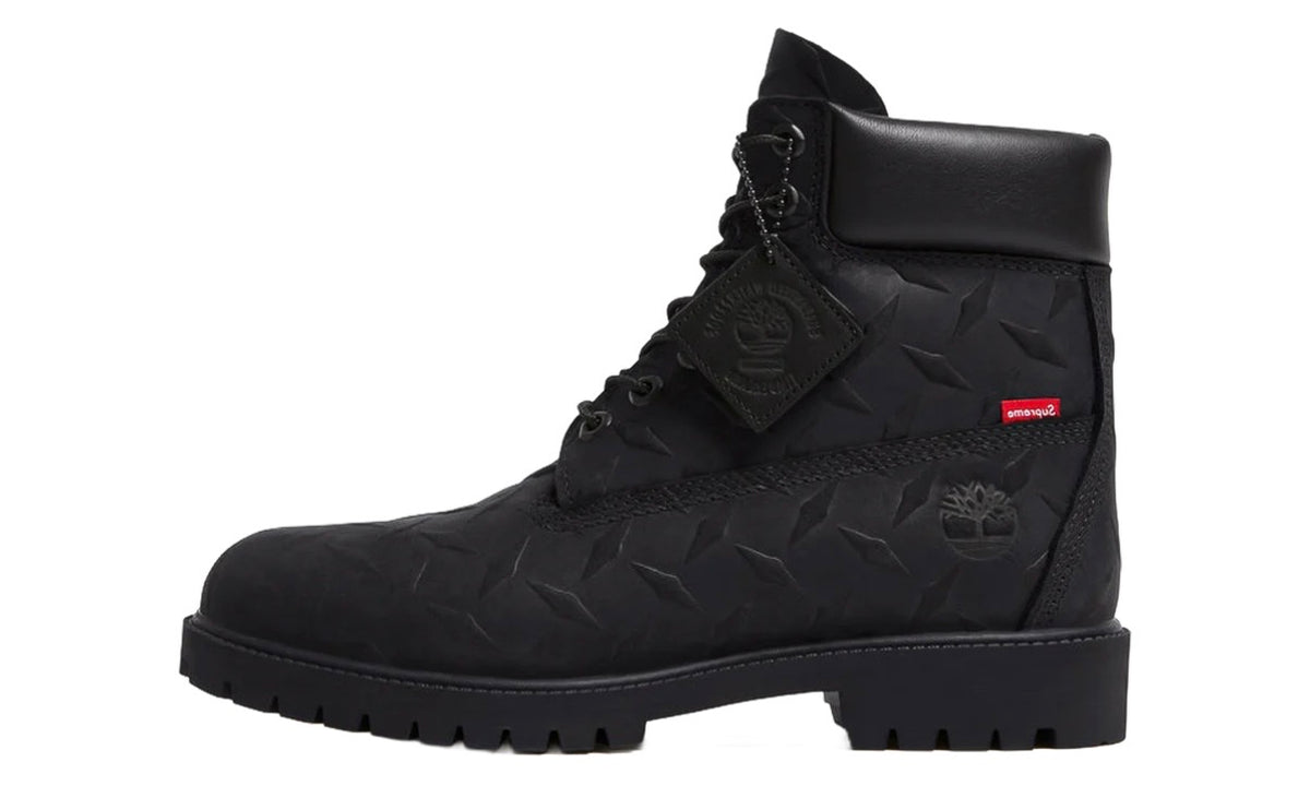 Timberland Supreme Black Diamond Plate 6" Boot, side view of the black boot with tonal laces, padded collar and Timberland hang tag