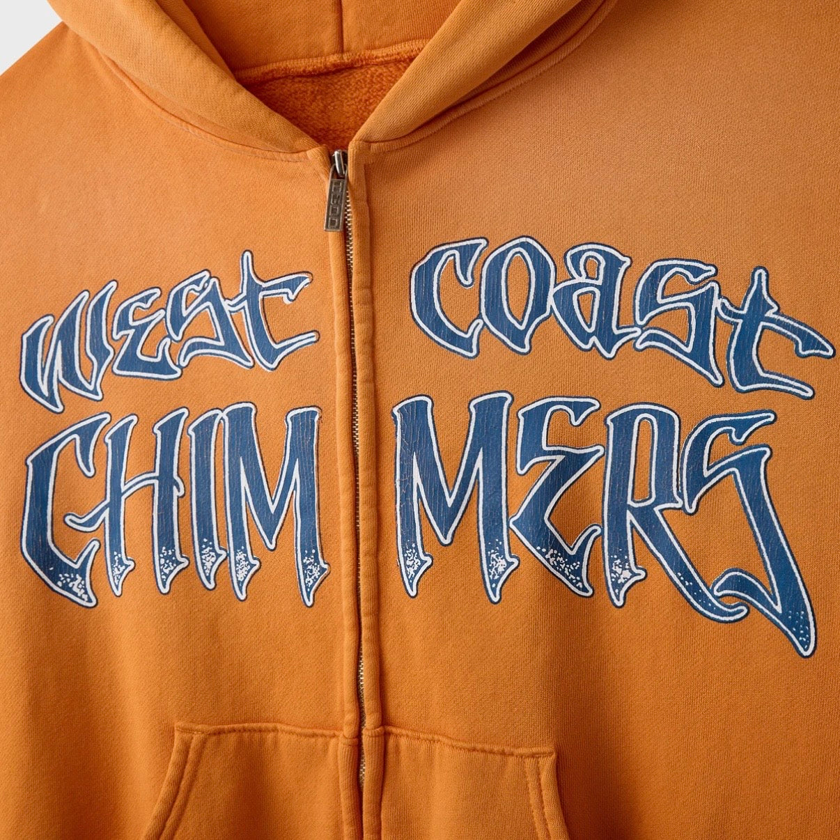 HMDD Cropped OC Summer Zip Hoodie, close-up of the blue gothic West Coast Chimmers print split across the zip