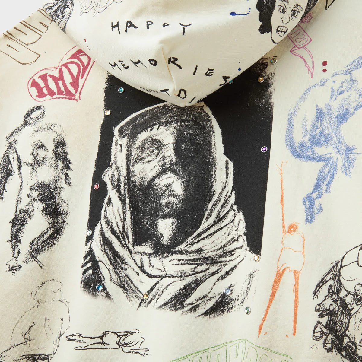 HMDD Sketch Hoodie, close-up of the charcoal portrait of a hooded figure with Happy Memories lettering and a red HMDD graphic