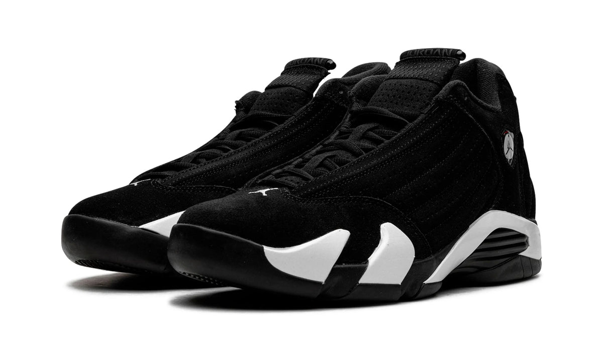 Jordan 14 Black White, front three-quarter view of the pair, black suede toes above white midsole panels