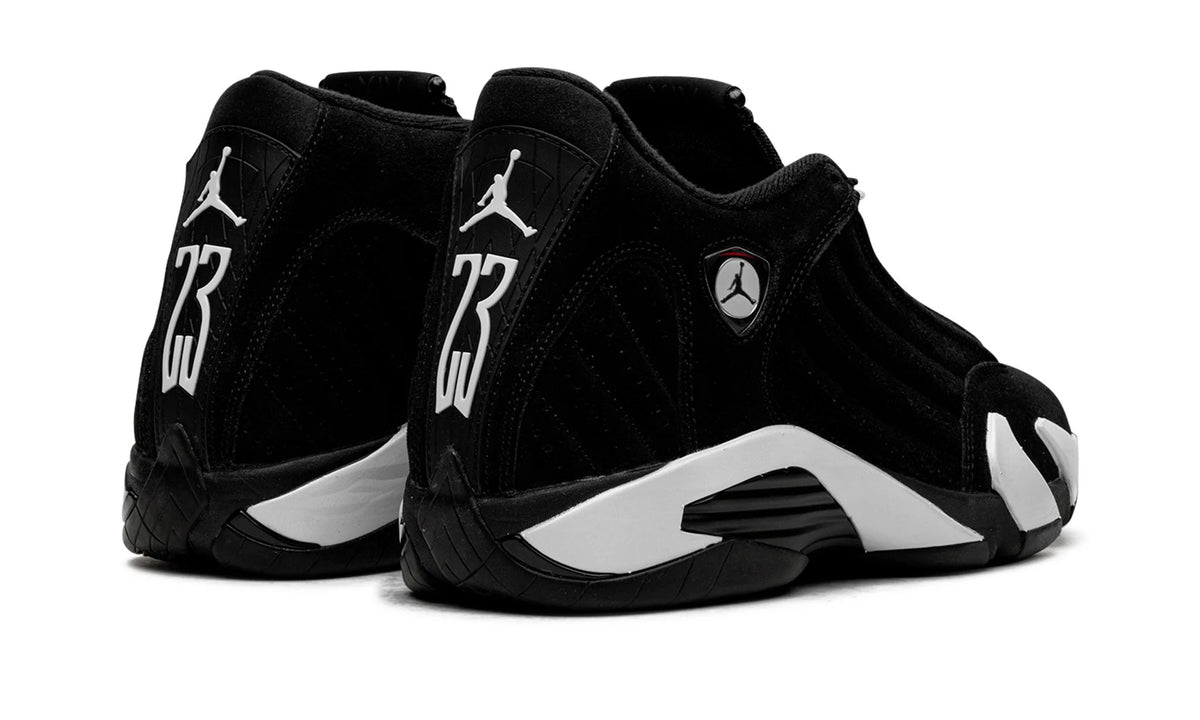 Jordan 14 Black White, rear angle of the pair, black heels marked 23 in white with Jumpman on the ankle