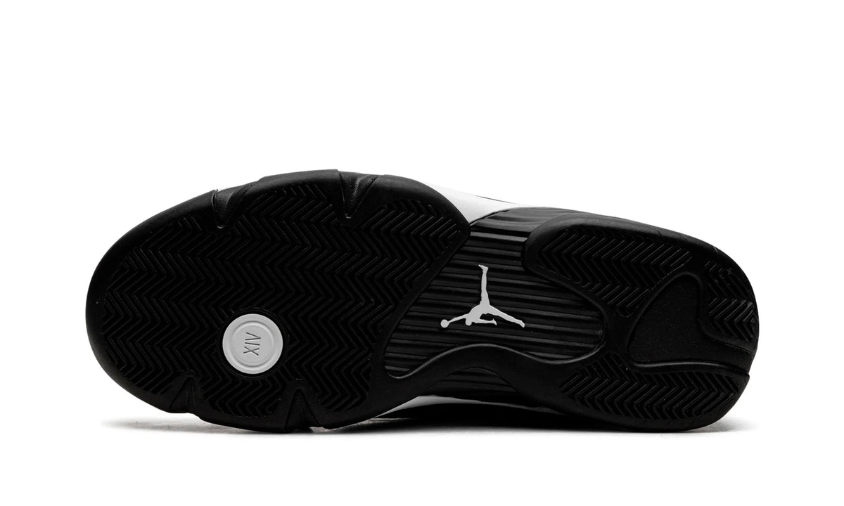 Jordan 14 Black White, bottom view of the black outsole with white Jumpman and a circular pivot point