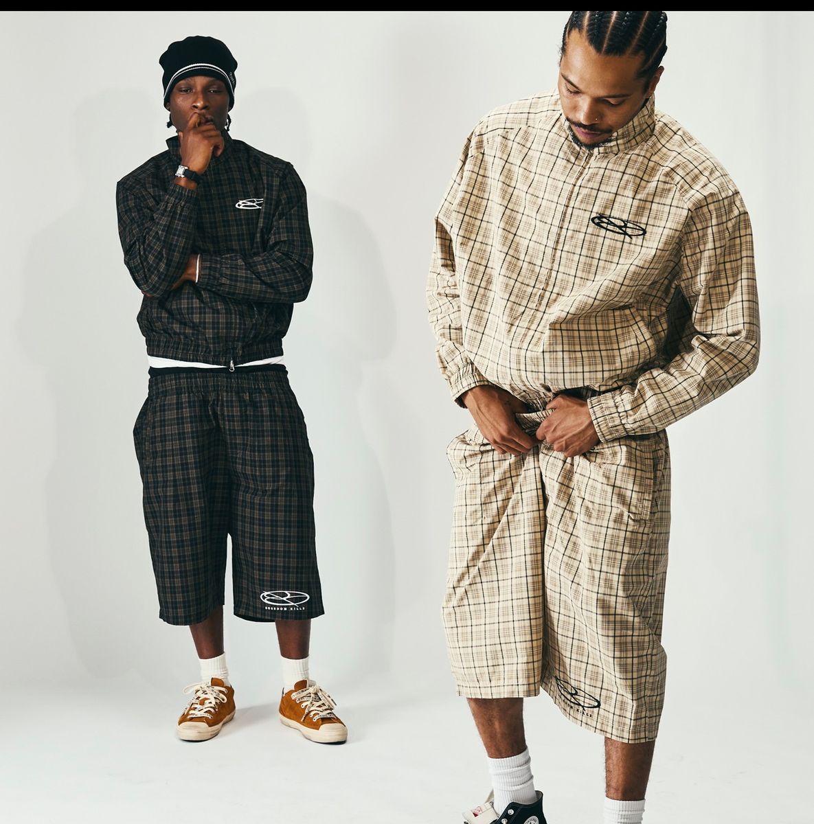 Boredom Kills Plaid Track Jacket — two models side by side in the black brown and the khaki colourways