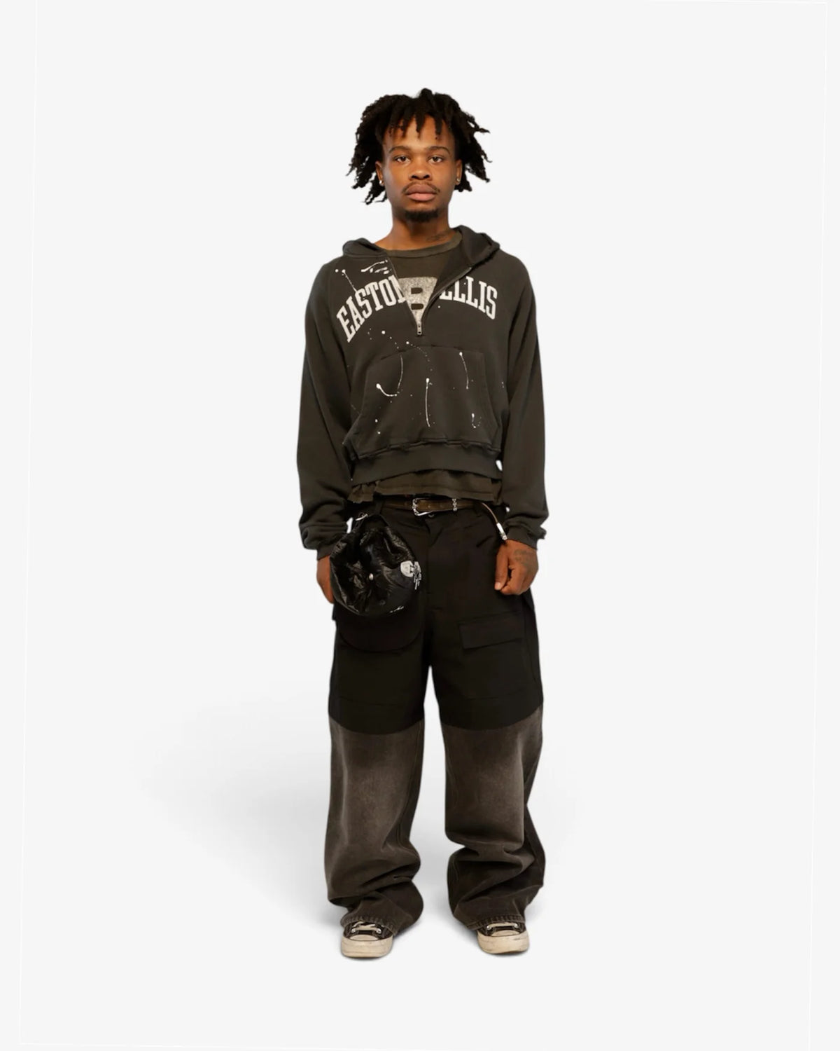 Model wearing the Easton Ellis half zip hoodie with wide two-tone pants, front view