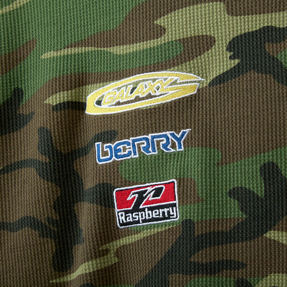Close-up of the GALAXY, BERRY and Raspberry chest patches on green camo