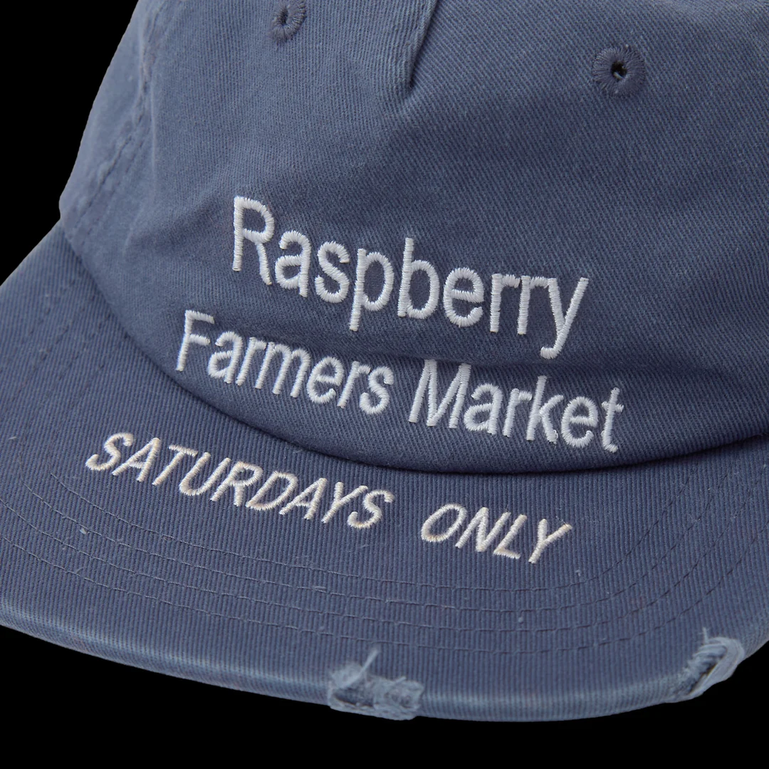 GV Gallery Farmers Market Hat, close-up of the white Raspberry Farmers Market front embroidery