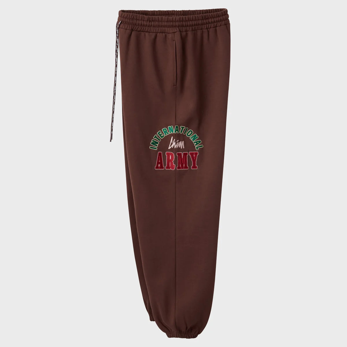 HMDD Brown International Sweats angled view showing the International Chim Army thigh graphic