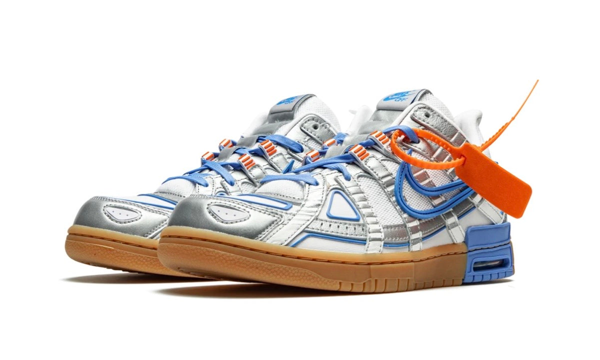 Pair of Off-White x Nike Air Rubber Dunk UNC from the front, silver and blue caged overlays
