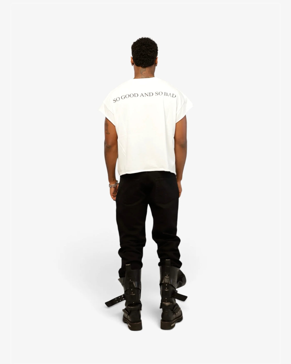 Male model from behind in white cut-off tee showing the back print