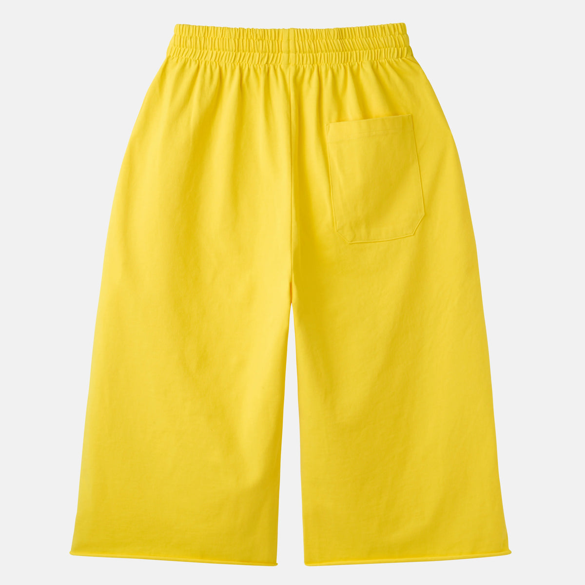 HMDD Yellow Program 3/4 Shorts, yellow cropped shorts laid flat showing the elastic waistband and a patch pocket