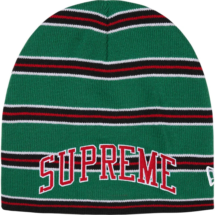 Supreme New Era striped beanie in green with red, black and white stripes, arched red SUPREME lettering and a New Era flag