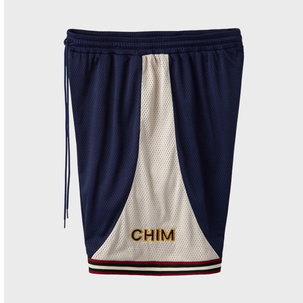 HMDD UE Basketball Shorts, the navy and cream mesh shorts with gold CHIM lettering on the cream side panel