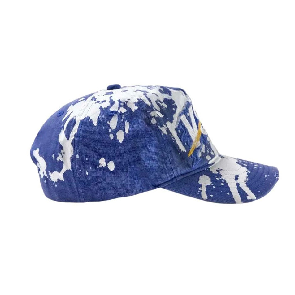Vale Blue VSX Paint Splatter Hat side profile — splattered side panel, crown seams, crown button and brim curve