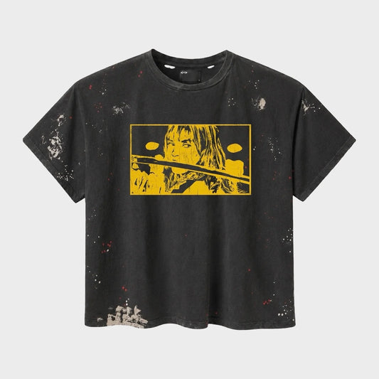 HMDD Black KB Vintage T-Shirt, washed black tee with paint splatter and a yellow panel print of a woman holding a sword
