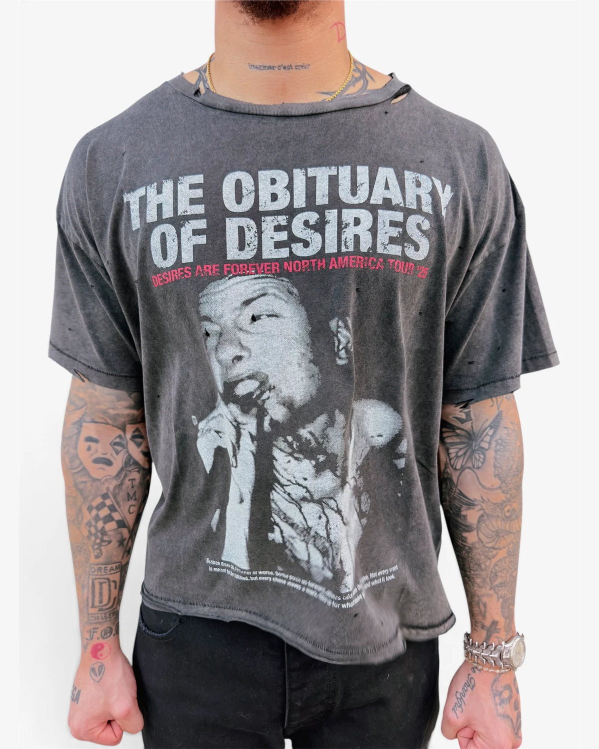Model wearing the washed charcoal Obituary tee, close front view showing the distressed collar