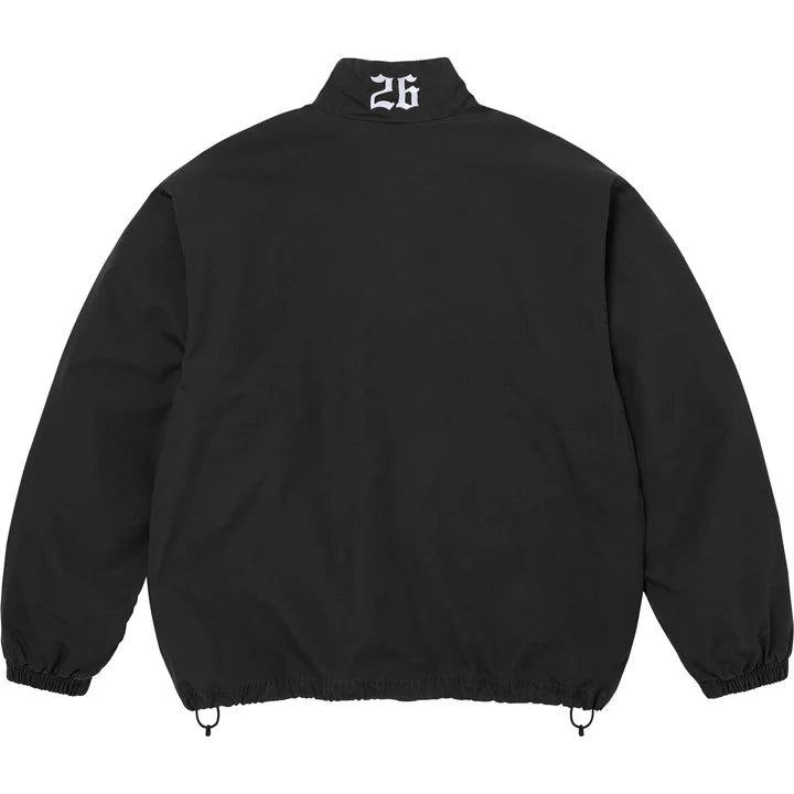 Back of the black Supreme x Umbro track jacket with 26 embroidered below the collar
