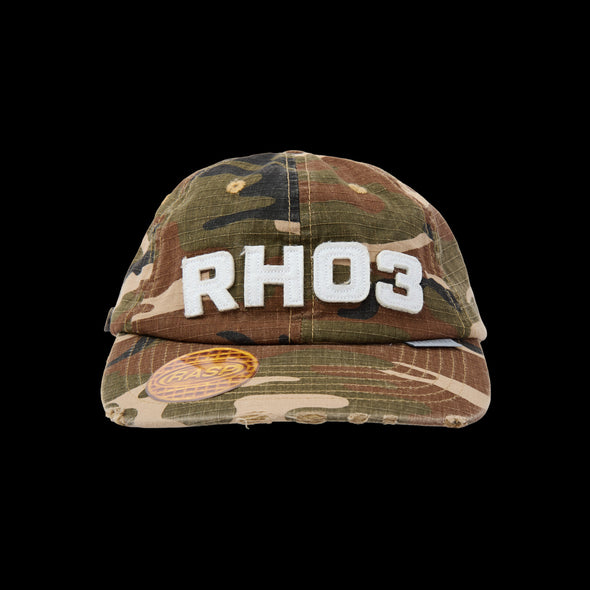 Front view of the woodland camo dad hat with white RHO3 and waffle brim patch