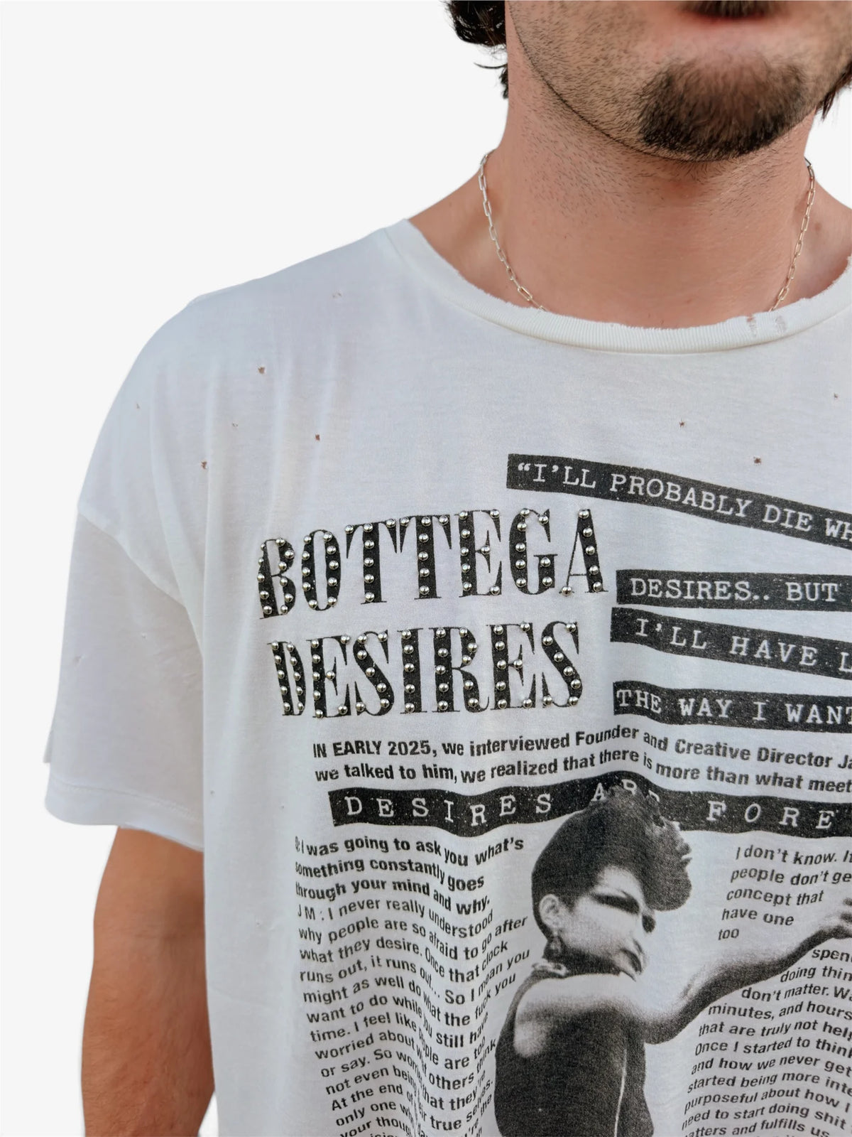 Model wearing the Interview tee, close front view of the printed interview layout