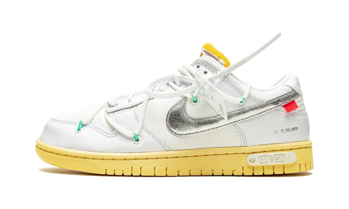 Off-White x Nike Dunk Low Lot 1 in white with metallic silver Swoosh, aged yellow midsole and white zip tie, lateral side view