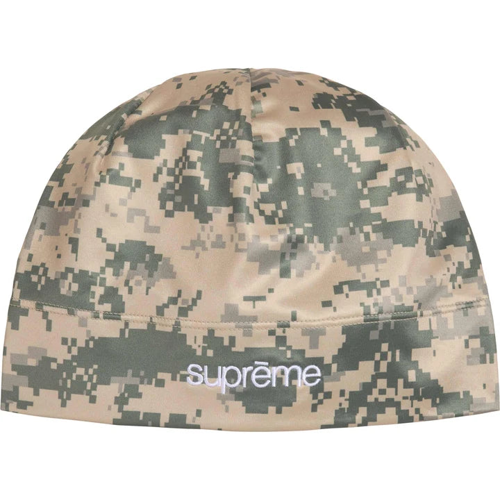 Supreme Base Layer beanie in tan and grey digital camo stretch fabric with a white Supreme logo at the front hem