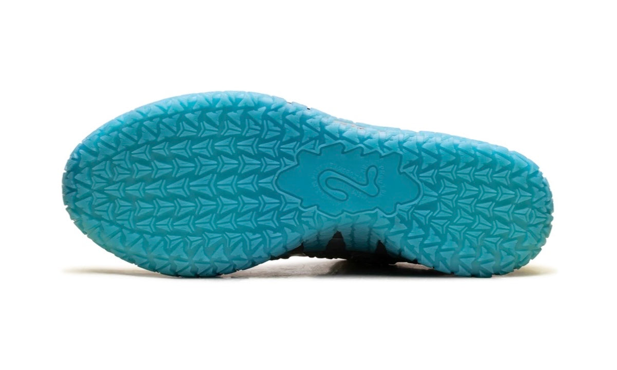 Teal translucent outsole of the Nike Ja 3 with triangular traction pattern