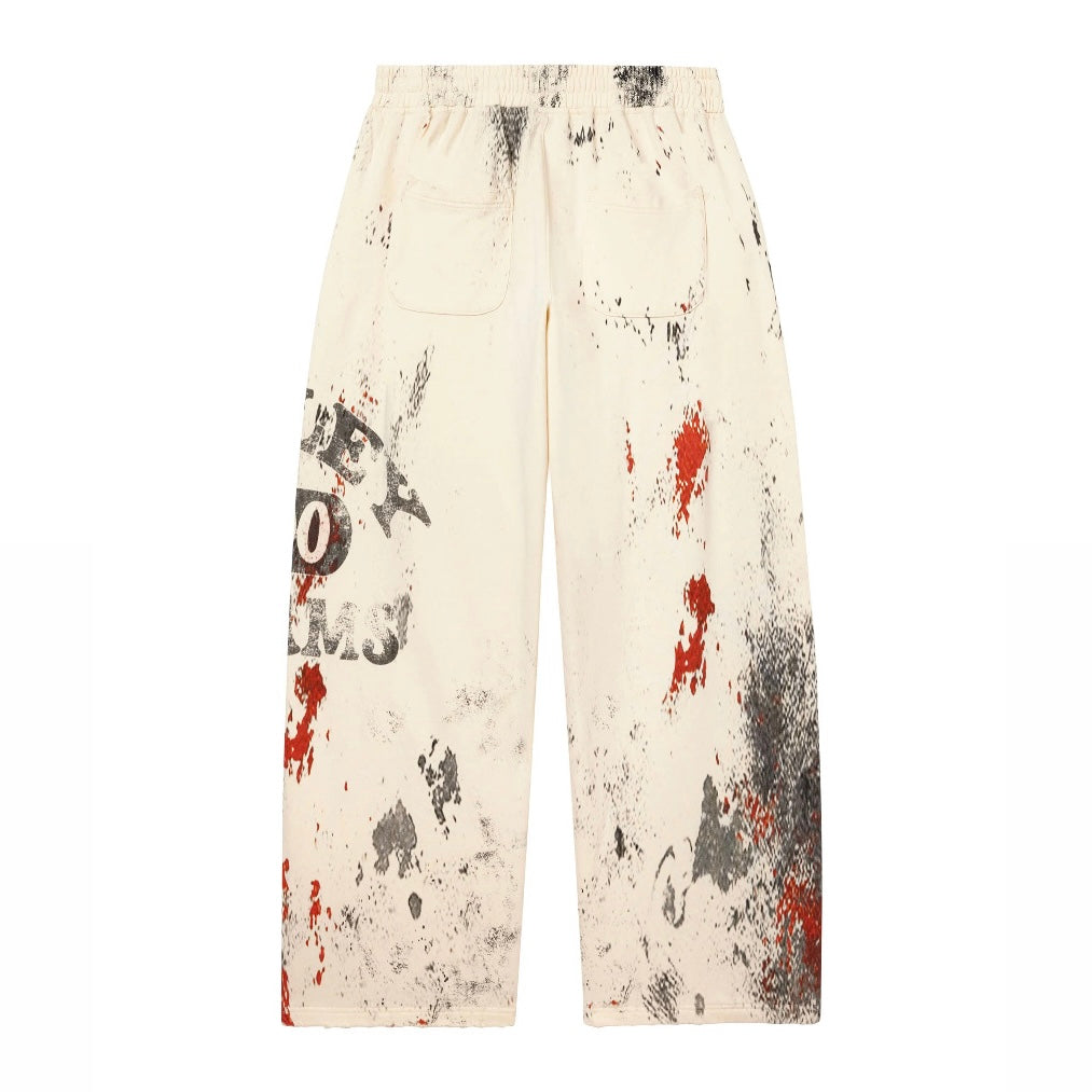 Vale Cream Picasso Sweatpants back view with the splatter print and patch pockets