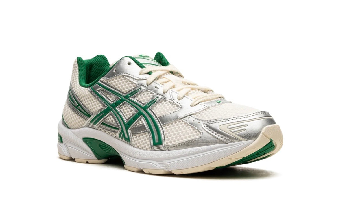Asics Gel-1130 Cream Kale, toe-first three-quarter view showing the green collar lining
