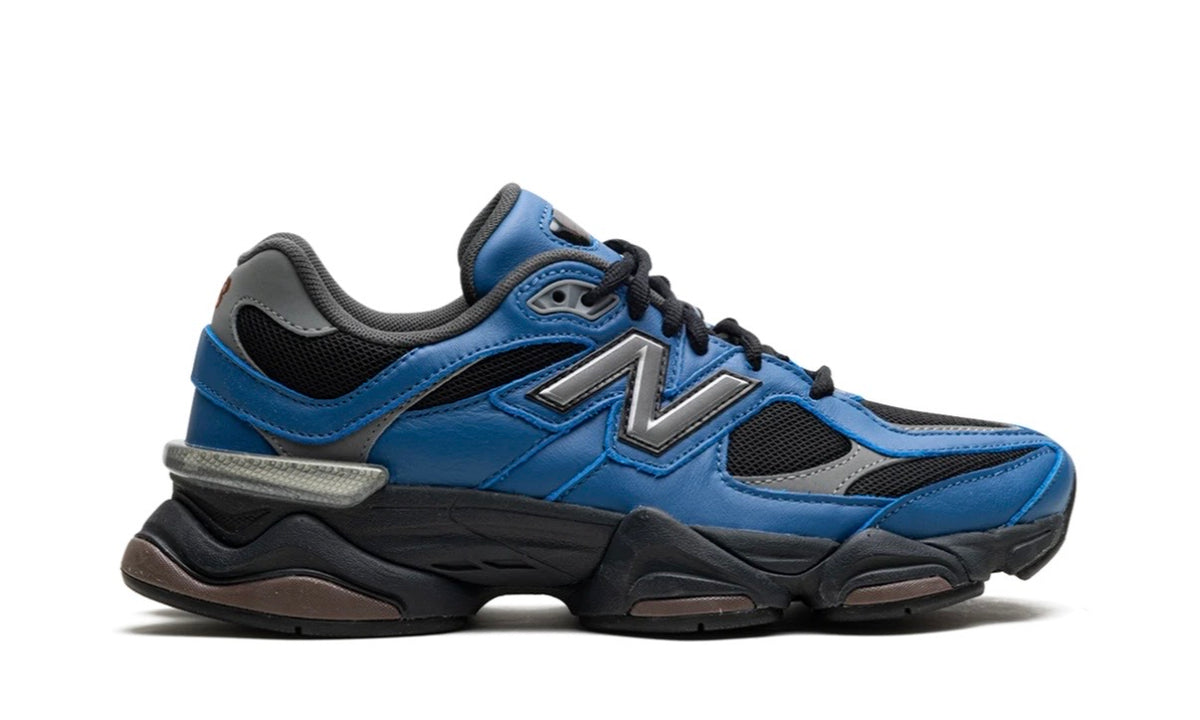 New Balance 9060 Dark Royal Brown, medial side profile with the silver heel accent and brown sole pods