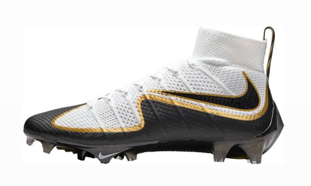 Nike Vapor Edge 360 Untouchable football cleat with white knit collar, black lower and metallic gold trim, lateral side view