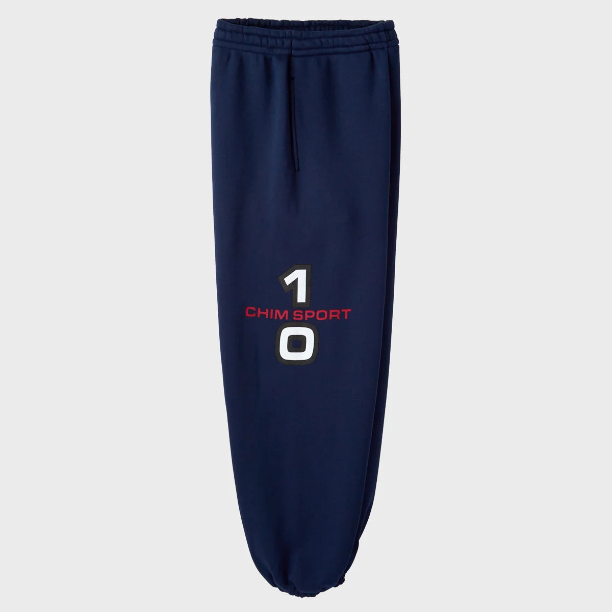 Side view of the HMDD navy sweatpants showing the 10 CHIM SPORT leg print