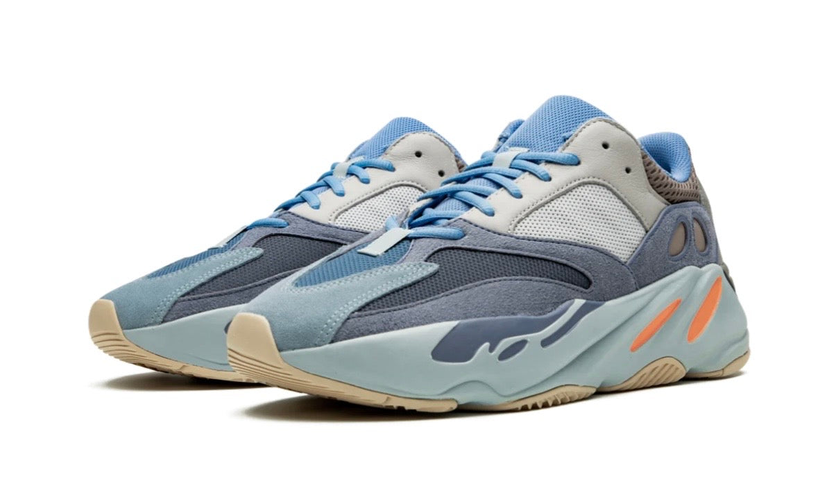 Adidas Yeezy 700 Carbon Blue, pair angled forward showing blue suede overlays, grey mesh and orange midsole pods