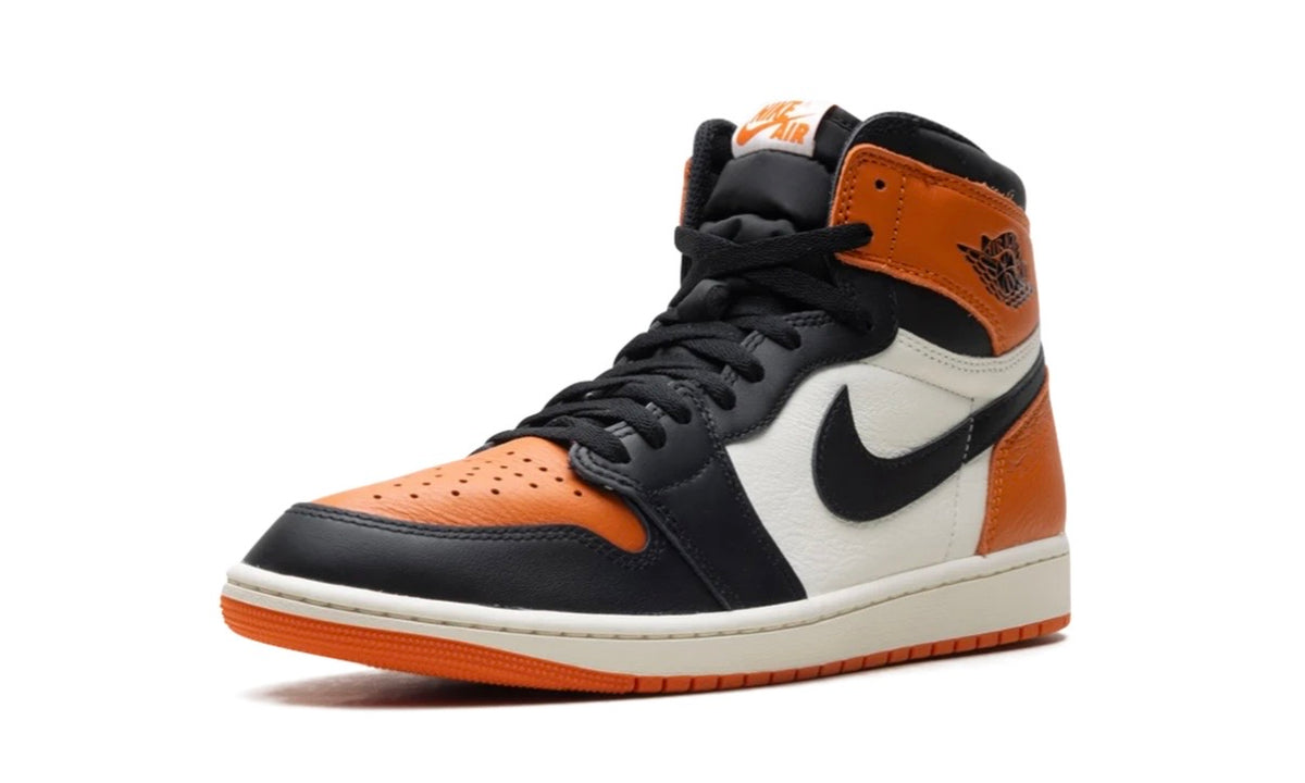 Air Jordan 1 High Shattered Backboard, front three-quarter view showing the black Swoosh and orange Wings logo