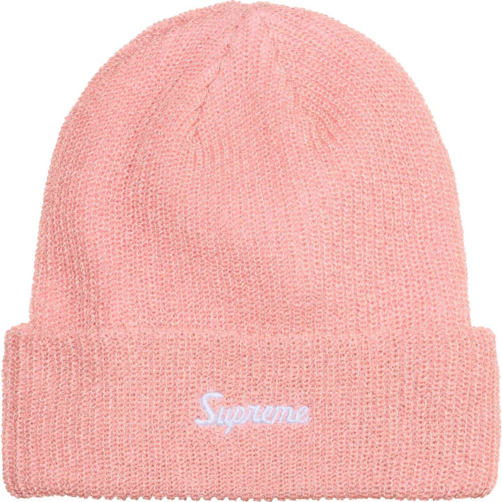 Soft pink loose gauge reflective beanie with white Supreme script, normal lighting