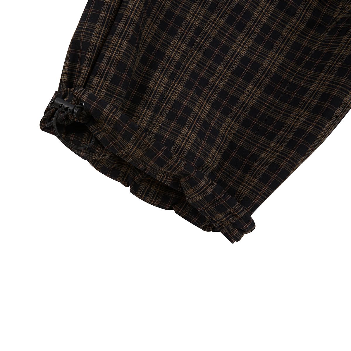 Boredom Kills Black Brown Plaid Track Pants close-up of the gathered elasticated cuff and the plaid weave