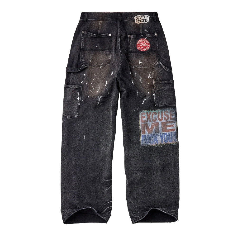 Vale Black American Hope Painter Pants, back view, washed black cargo denim with paint splatter, a red round patch and a printed leg patch