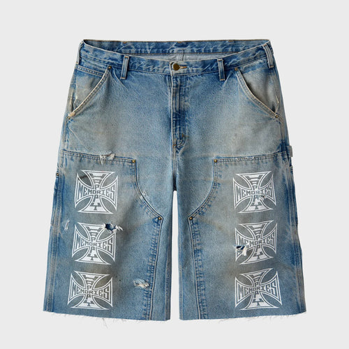 HMDD Chopper shorts in light wash denim with carpenter details, frayed hems and white iron cross MEMORIES prints down both legs, front view