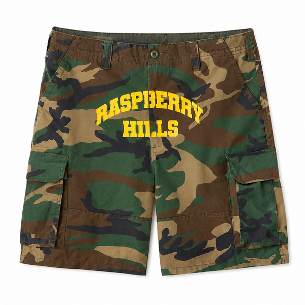 GV Gallery Camo Cargo Shorts, front flat lay of the woodland camo shorts with yellow arched Raspberry Hills print and side cargo pockets