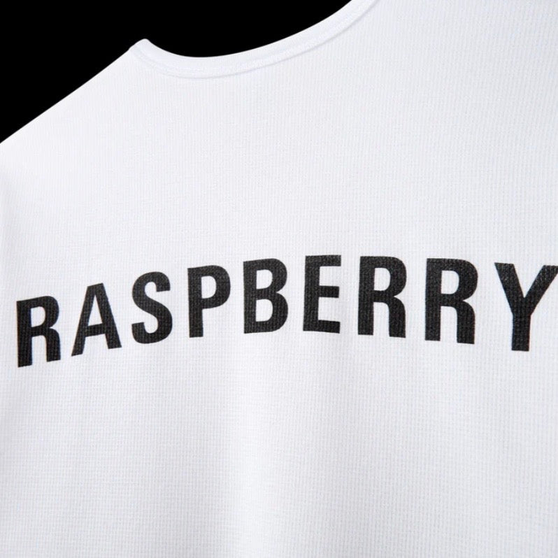 GV Gallery Kimbo Slice Thermal, close-up of the large RASPBERRY print below the ribbed collar on white waffle knit