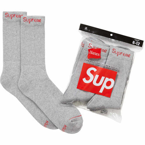 Supreme Hanes Grey Crew Socks 4 Pack, two heather grey ribbed crew socks beside the sealed four-pack bag with a red box logo